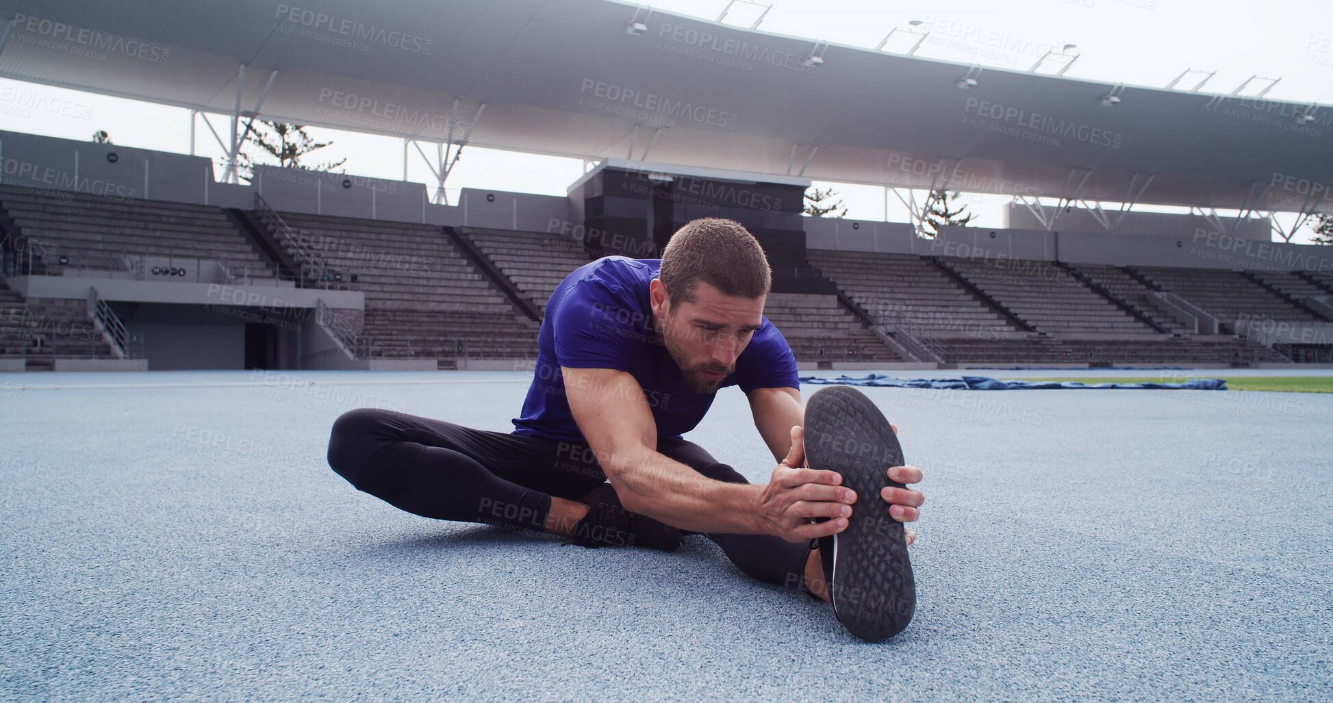 Buy stock photo Athlete, man and stretching legs for fitness, exercise and getting ready for marathon at stadium. Male person, warm up muscles and training routine, runner workout and prepare for sports competition