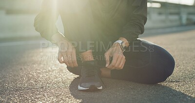 Buy stock photo Hands, runner and tie shoelaces in city, bridge and reflection with fitness routine in morning. Person, athlete and feet for training in street, exercise and start workout for wellness in town