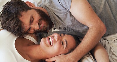Buy stock photo Love, romance and couple with laughing on bed for funny conversation, bonding together and security. Home, people and happy with affection in bedroom for healthy relationship, marriage joke and above