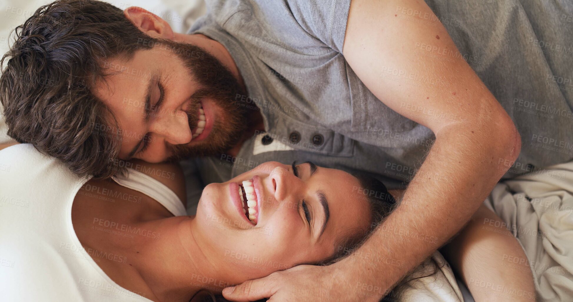 Buy stock photo Love, romance and couple with laughing on bed for funny conversation, bonding together and security. Home, people and happy with affection in bedroom for healthy relationship, marriage joke and above