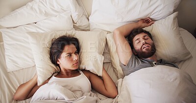 Buy stock photo Couple, bedroom and woman with man snoring, loud or noise with frustrated partner in home. Person with sleep apnea, angry or annoyed wife with sleepless night, awake and upset in bed at house