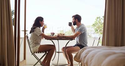 Buy stock photo Breakfast, drink and holding hands with couple on balcony of home together for bonding. Coffee, juice and morning meal with happy people outdoor at apartment for anniversary, honeymoon or romance