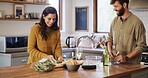 Cooking, ingredients and recipe with couple in kitchen of home together for meal preparation. Bonding, food and love with man and woman at counter in apartment for diet, healthy eating or nutrition
