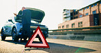 Warning sign, car breakdown and triangle on road with problem, fail or roadside assistance. Frustrated, back of person and reflective for highway safety, emergency or mechanical crisis outdoor
