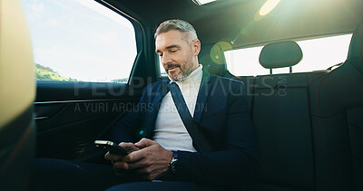 Buy stock photo Commute, drive and phone with business man in car for agenda, schedule or text message. Reading, ride share and travel with mature passenger in backseat for communication or transport with lens flare