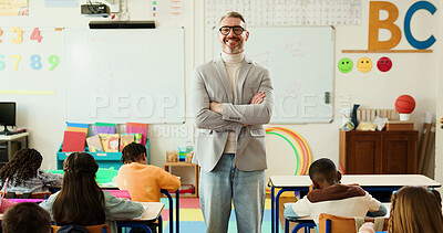 Buy stock photo Crossed arms, man and portrait of educator in classroom with confidence for education career. Students, happy and male teacher with children for lesson with learning or knowledge at elementary school
