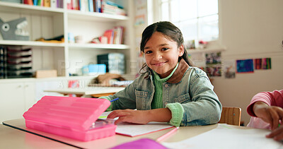 Buy stock photo Happy, writing and portrait of kid in classroom with confidence for education, learning or growth. Smile, student and face of girl child at elementary school for quiz, test or assessment at campus.