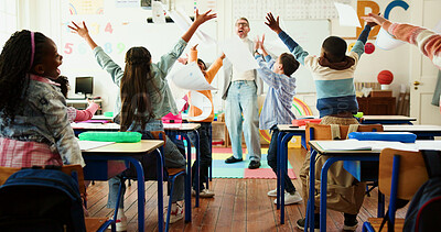 Buy stock photo Paper, celebration and education with teacher and kids in classroom for quiz pass, success and lesson. Exam achievement, learning and test grade with students and man in school for scholarship
