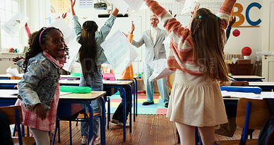 Buy stock photo Exam, paper and success with teacher and kids in classroom for education, support and quiz. Winner, scholarship and test grading pass with students and man for child development and celebration