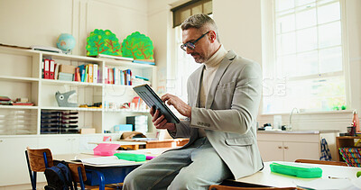 Buy stock photo Reading, tablet and education with teacher in classroom for digital exam, support and report results. Learning, scroll and online test grading with man in school for child development and growth