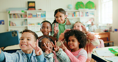 Buy stock photo Education, peace sign and selfie with children in class together for learning or memories. Development, growth and profile picture with group of happy kids in school classroom for social media