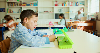 Buy stock photo Education, child and writing in classroom for learning, lesson and creativity with stationery. Kid, notebook and drawing in elementary school for development, growth and cognitive thinking in profile