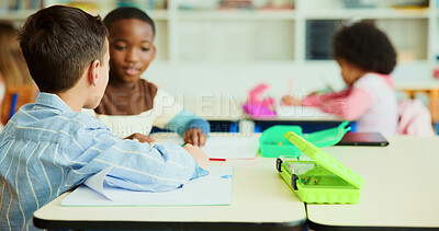 Buy stock photo Learning, students and children in classroom for knowledge, test and writing exam or study. Kids, talking and team in lesson for education or friends for conversation and help together at school