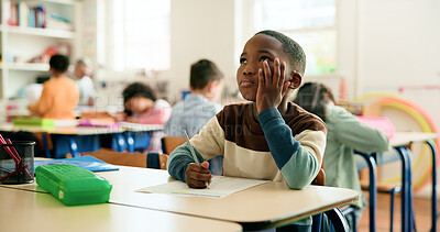 Buy stock photo Thinking, quiz or boy in classroom for writing education, maths or solution with students. Test, problem solving or kid learning at school for child development, assessment or knowledge evaluation