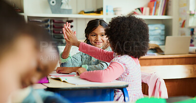Buy stock photo Children, smile and high five in classroom for success, education and teamwork. Happy girls, students and hands together for celebration with friends for learning, support or pass test in school