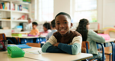 Buy stock photo Boy, child and smile in classroom with arms crossed, portrait and confidence for learning at academy. Kid, happy learner and pupil for education, study or development with pride at elementary school