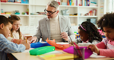 Buy stock photo Education, future or study with students and teacher at desk in classroom for child development. Growth, learning or teaching with educator man and kids in elementary school class for lesson