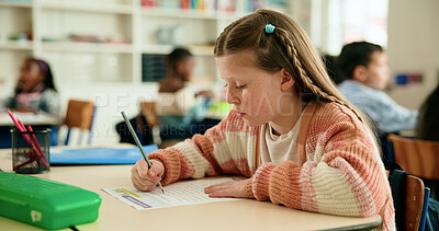Buy stock photo Girl, child and writing test in classroom with problem solving, development or assessment at academy. Kid, paper and solution for question with language, learning and education at elementary school