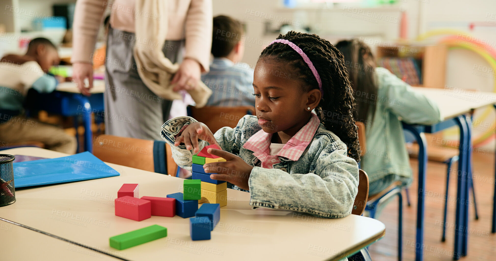 Buy stock photo Girl, education and building with blocks in classroom, learning and puzzle for problem solving with games. Child, wood toys and development with shapes, solution and thinking at elementary school