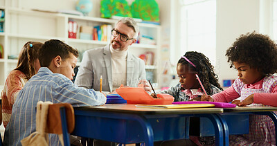 Buy stock photo Elementary, teacher and man with children, writing or helping students with assignment or education. Knowledge, growth and development of kids in classroom, educator and teaching learner in school