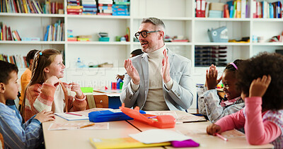 Buy stock photo Applause, support and teacher with kids in classroom for learning, education and assessment group. Celebration, child development and success with students and man in school for scholarship news
