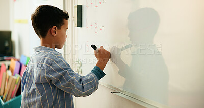Buy stock photo Education, child and math on whiteboard, classroom and problem solving with calculation and writing. Knowledge, counting and kid with skill development in elementary, growth and learning in school