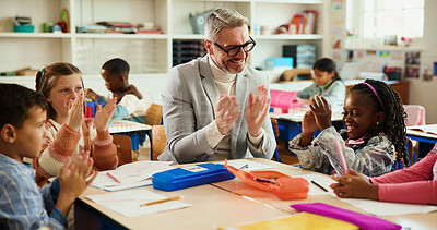 Buy stock photo Applause, happy and teacher with kids in classroom for learning, support and assessment group. Celebration, child development and success with students and man in school for scholarship news