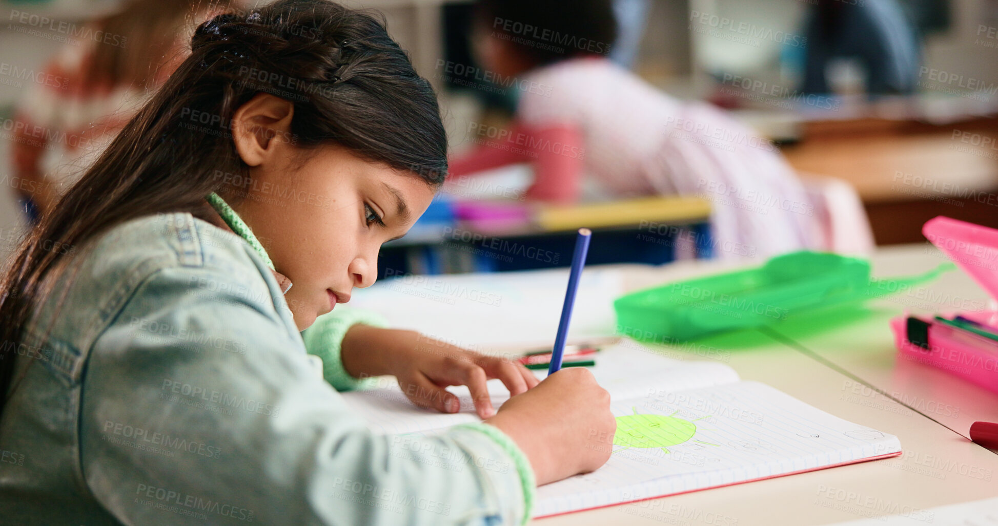 Buy stock photo Education, classroom and child drawing in notebook, writing and creative in elementary school. Pencil, girl and kid with book for art, learning and student with color for motor skill development