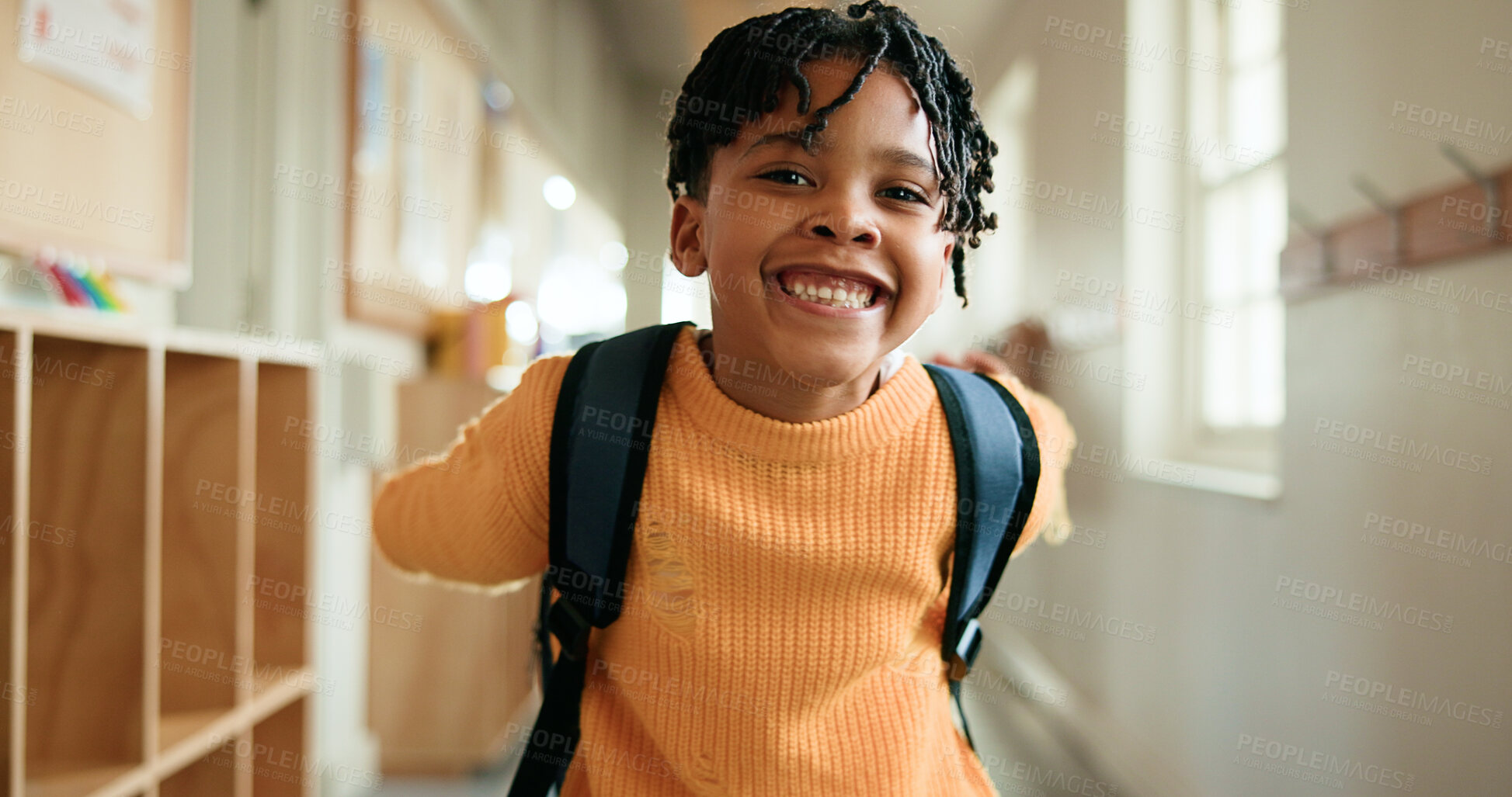 Buy stock photo Education, portrait and smile of black child in school corridor for development, learning or study. Excited, future and growth with happy African boy in academy hallway for knowledge as student