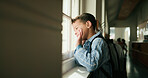 Boy, happy and wave at window, school and ready for learning, development or thinking in corridor. Child, smile and greeting with gesture, backpack and goodbye in hallway for education at academy