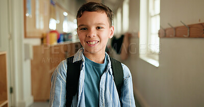 Buy stock photo Portrait, happy and child with backpack at school for education, learning and scholarship. Smile, kid and boy student in hallway for study opportunity, knowledge growth and academic pride in lobby