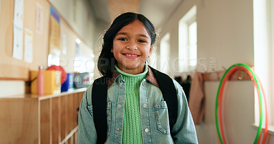Buy stock photo Child, portrait and smile in hallway for education, learning opportunity or back to school. Girl, backpack or happy at montessori for development, growth and knowledge or academic scholarship in Cuba
