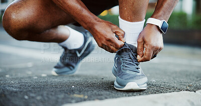 Buy stock photo Hands, shoelaces and man in city, fitness and training for marathon, routine and exercise. Outdoor, person and athlete in street, sneakers and start day with practice, smart watch and workout