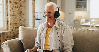 Buy stock photo Elderly, happy man and playing with video games on sofa for competitive action or esport in home. Senior, male person or gamer with smile, controller or headphones for online competition in house