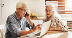 Elderly couple, laptop and phone call for finance, budget or talking for loan fee. Computer, man and woman on mobile for mortgage, pension savings or bank charge on retirement account in home kitchen