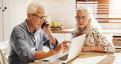 Buy stock photo Elderly couple, laptop and phone call for finance, budget or talking for loan fee. Computer, man and woman on mobile for mortgage, pension savings or bank charge on retirement account in home kitchen