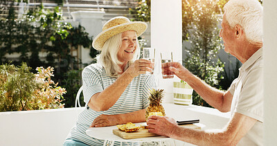 Buy stock photo Happy, senior couple or toast with glass in backyard for summer bonding, holiday or outdoor weekend. Elderly, man and woman with pineapple or cheers for natural organic drink, diet or mineral liquid