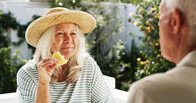 Buy stock photo Patio, old couple and talking with fruit, home or conversation on weekend, wellness or healthy food. Outdoor, senior woman and elderly man with pineapple on break, romance and people with commitment