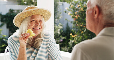 Buy stock photo Patio, old couple and break with fruit, home and conversation on weekend, wellness and healthy food. Outdoor, senior woman and elderly man with pineapple on date, romance or people with commitment