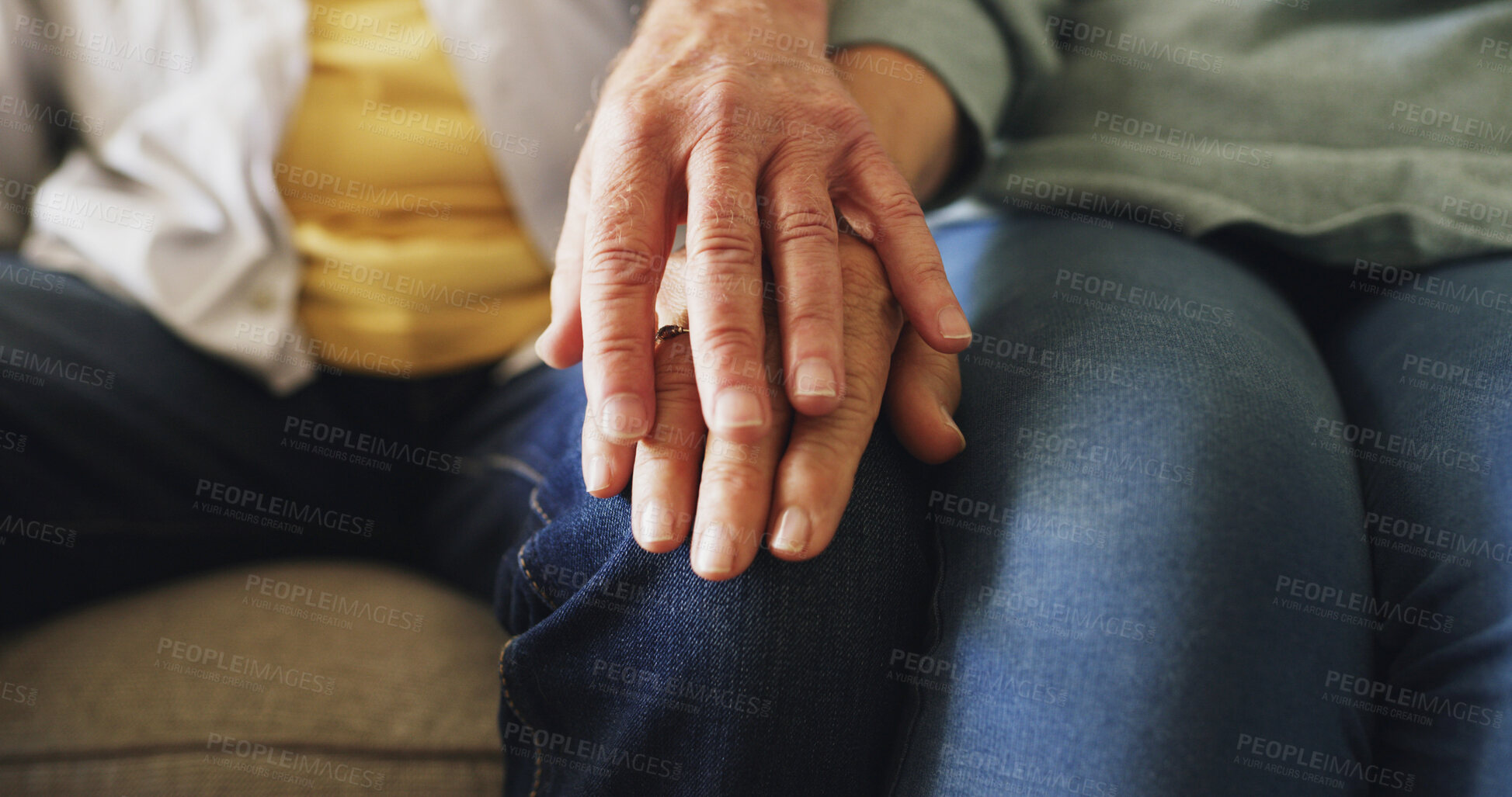 Buy stock photo Love, senior couple and holding hands in home for retirement support, bonding together or security. Pensioner, elderly people and affection on sofa for appreciation, marriage commitment or connection