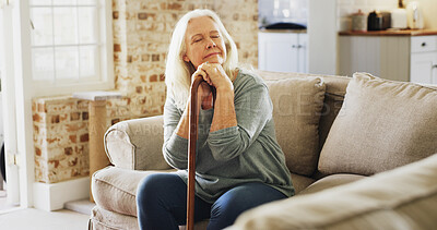 Buy stock photo Senior woman, thinking and sofa with cane for memory, nostalgia or daydreaming in retirement home. Elderly, female person or contemplating with walking stick or aid on couch for old past in house