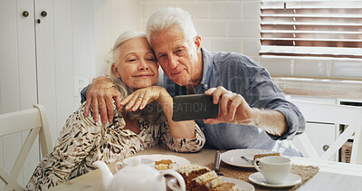 Buy stock photo Old couple, smile and selfie with breakfast, kitchen and photo for memory on social media or online. Happy, senior man and profile picture with elderly woman, bonding and people with coffee in home