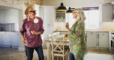 Buy stock photo Funny, senior couple and dancing with fashion in kitchen for humor, dressup or cosplay in home. Elderly, man and woman with vibe or energy in costume for retirement comedy or comic in house together