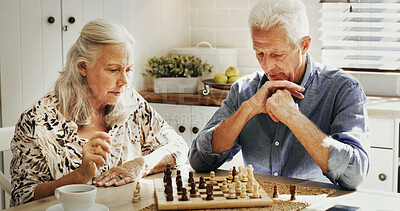 Buy stock photo Thinking, senior couple and playing chess in home with decision, problem solving and strategy. Retirement hobby, elderly people and bonding with board game in house for challenge and cognitive skills