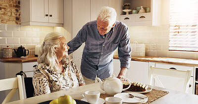 Buy stock photo Talking, tea and wheelchair with old couple in kitchen of home together for retirement or wellness. Cake, hunger and senior man speaking to woman with disability in apartment for start of morning