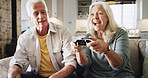 Home, video game and senior couple with smile, bonding together and winning in lounge. Victory, contest and man with woman, entertainment and competition with hobby, excited or gaming with controller