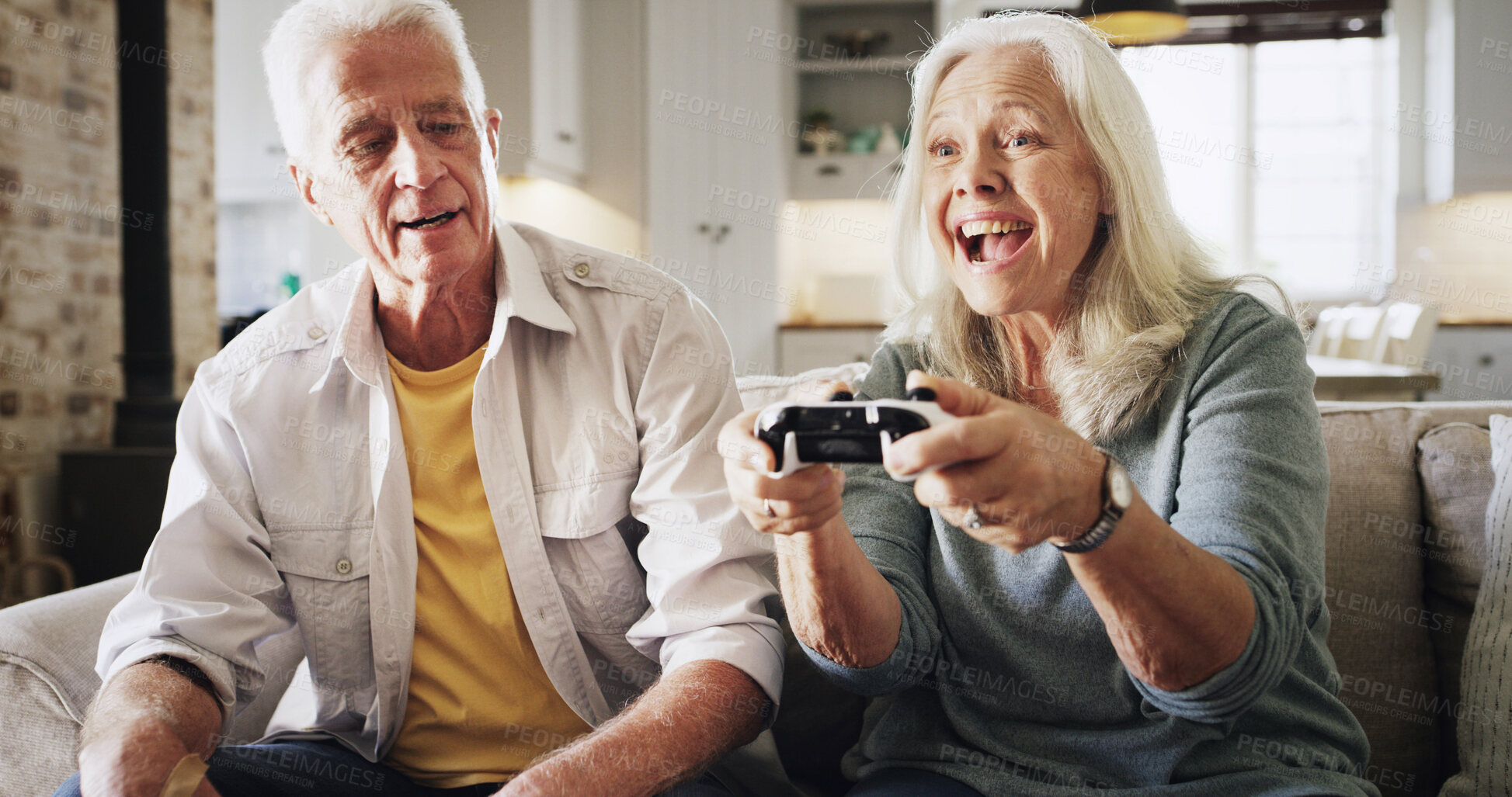 Buy stock photo Home, video game and senior couple with smile, bonding together and winning in lounge. Victory, contest and man with woman, entertainment and competition with hobby, excited or gaming with controller