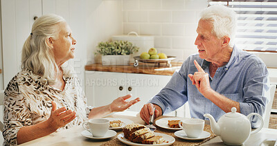 Buy stock photo Breakfast, argument and senior couple in home with disagreement together for morning meal. Upset, fighting and elderly man with woman for eating food with marriage problem in kitchen in house.