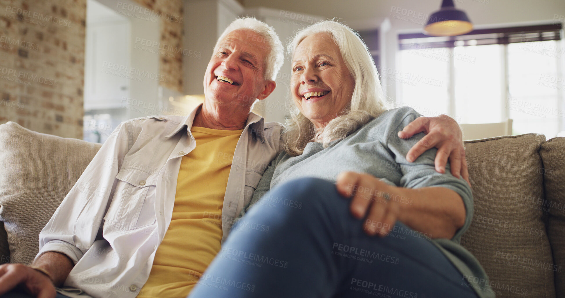 Buy stock photo Senior couple, hug and watching tv on sofa with bonding together, streaming subscription or series. Happy, elderly people and relax in house with online movie, weekend break and retirement support