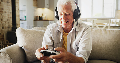 Buy stock photo Senior, happy man and playing with video games on sofa for competitive action or esport in home. Elderly, male person or gamer with smile, controller or headphones for online competition in house